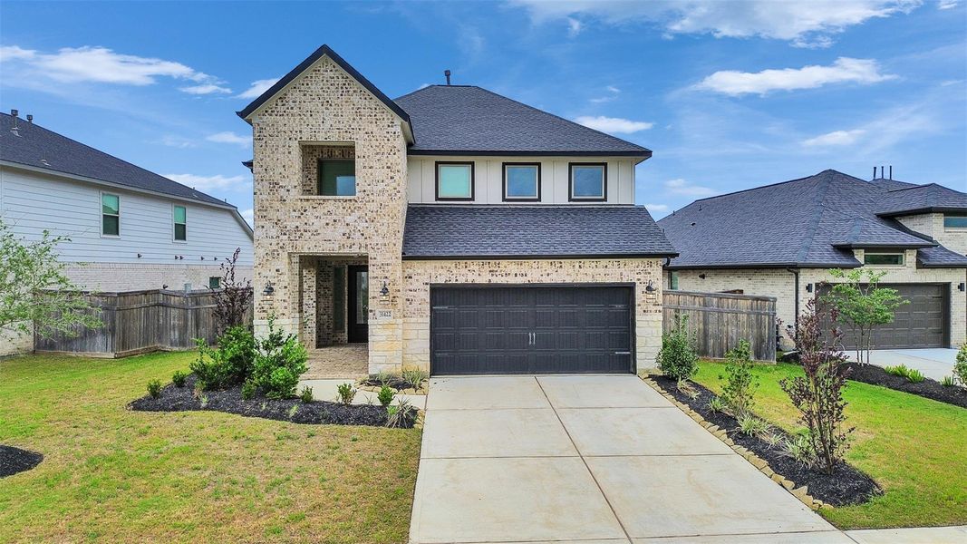 Front exterior of a new home in Cross Creek West, Fulshear, TX, highlighting curb appeal (Image 22).