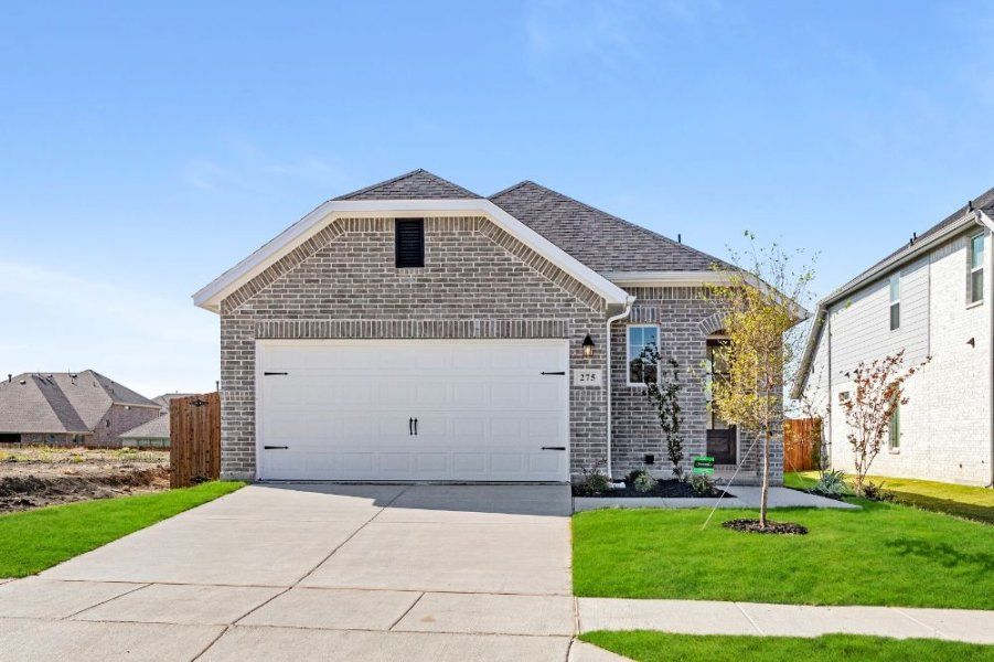 Representative exterior photo of a completed home built from the Chisholm by UnionMain Homes in Elevon, Lavon, TX (Image 18).