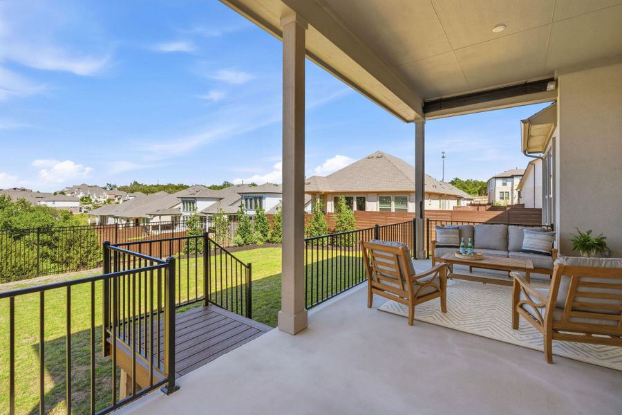 Balcony with a residential view and outdoor seating Balcony with a residential view and outdoor seating
