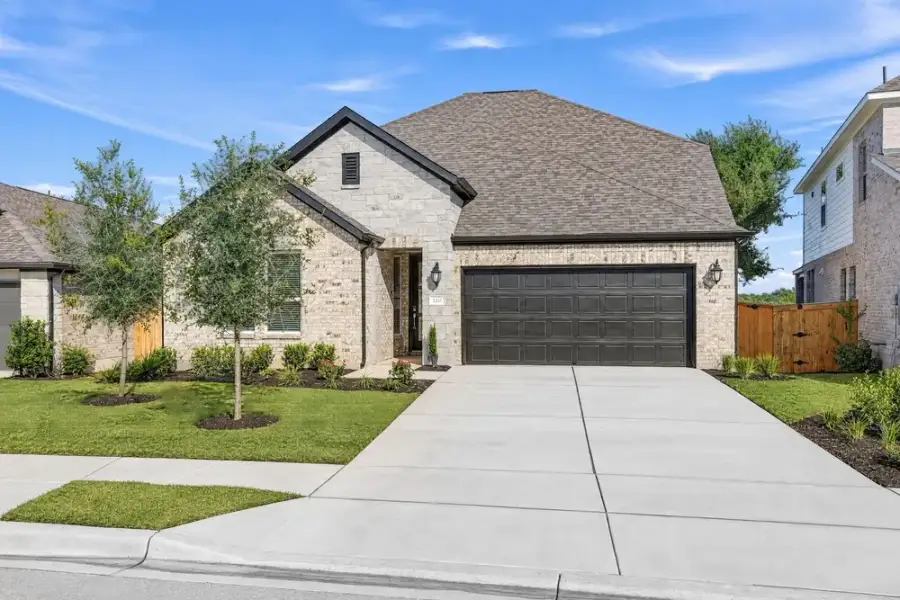 Front exterior of a new home in Parkside on the River, Georgetown, TX, highlighting curb appeal (Image 21). Front exterior of a new home in Parkside on the River, Georgetown, TX, highlighting curb appeal (Image 21).