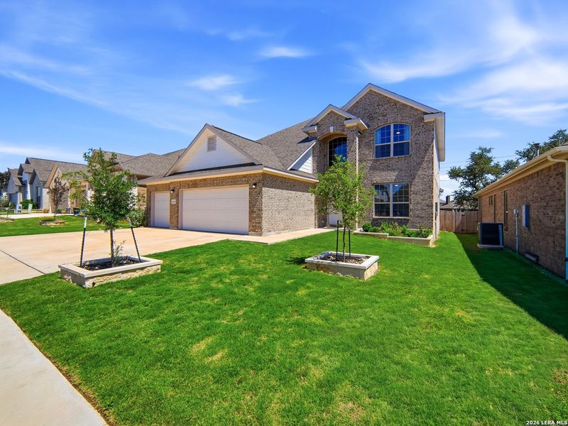 Front exterior of a new home in Ventana, Bulverde, TX, highlighting curb appeal (Image 24).