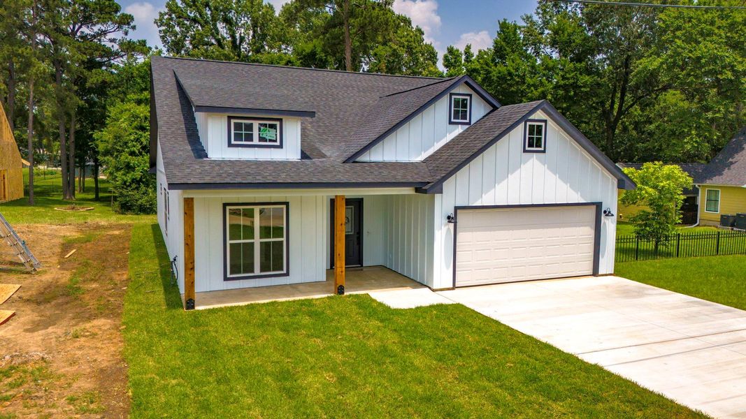Front exterior of a new home in , Onalaska, TX, highlighting curb appeal (Image 18).
