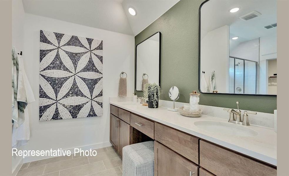 Dual vanity with undermount sinks, brushed nickel fixtures, and a light-toned countertop