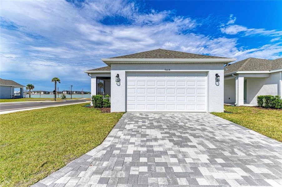 Front exterior of a new home in , Sarasota, FL, highlighting curb appeal (Image 23).