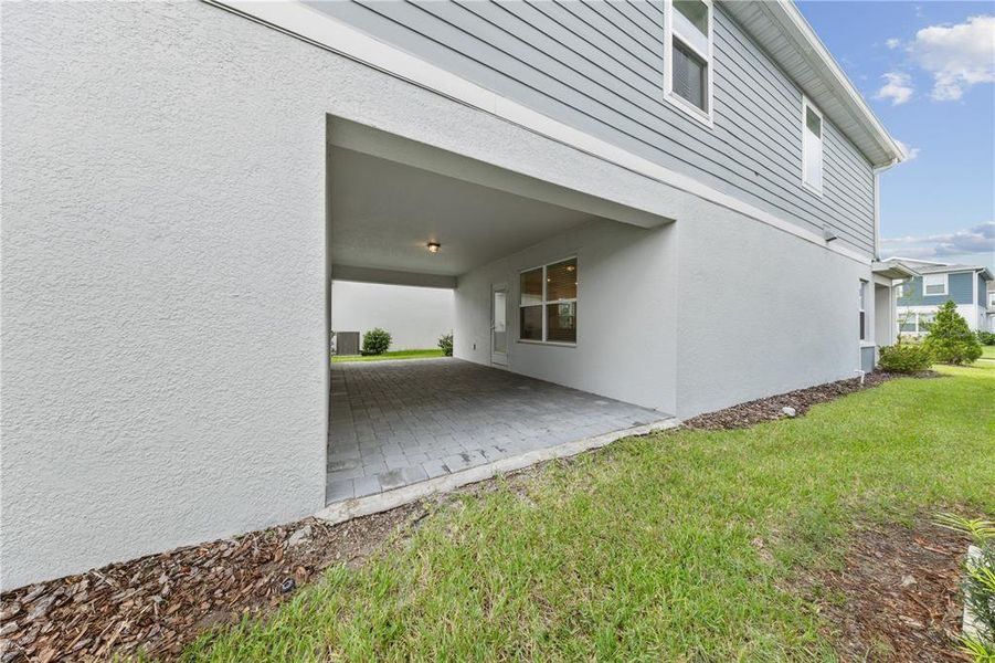 Exterior details and patio area of a home in EverBe, Orlando (Image 4).