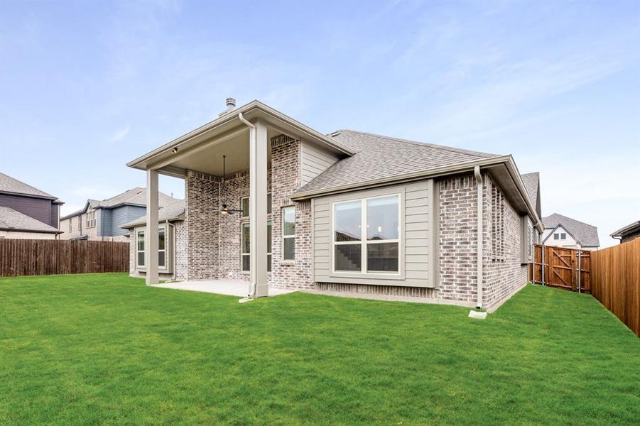 Exterior details and patio area of a home in Villages of Hurricane Creek, Anna (Image 28).
