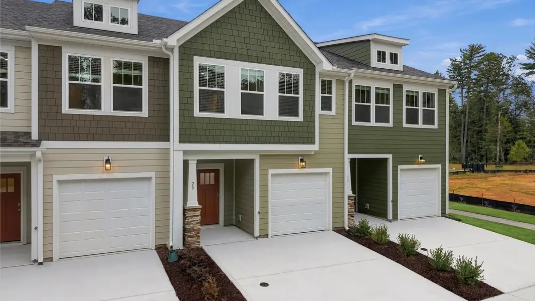 Front exterior of a new home in Brookland Place, Hendersonville, NC, highlighting curb appeal (Image 1). Front exterior of a new home in Brookland Place, Hendersonville, NC, highlighting curb appeal (Image 1).