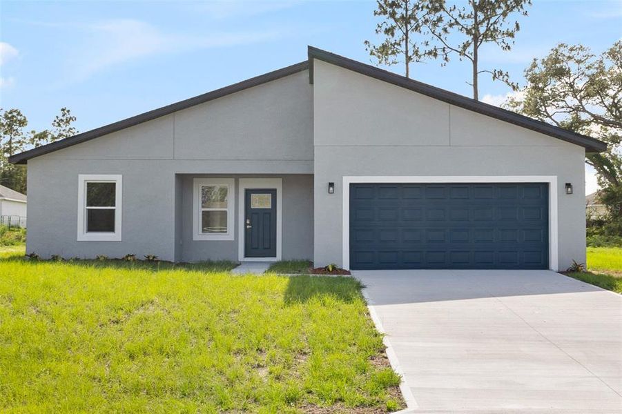 Front exterior of a new home in , Ocala, FL, highlighting curb appeal (Image 2).