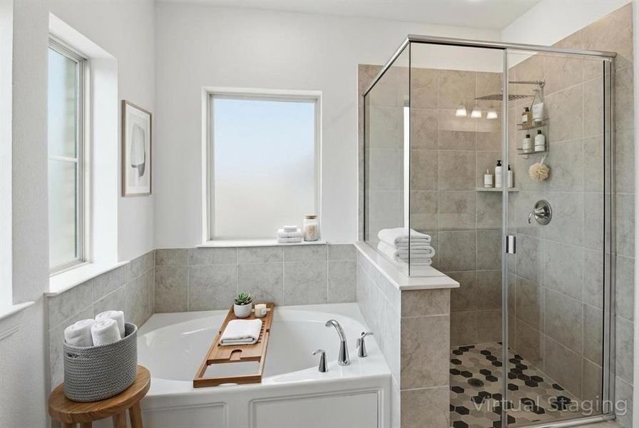 Virtually Staged Primary Bath with an oversized walk in shower and soaking tub.