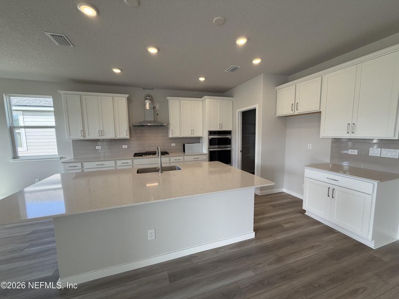Furnished interior view inside a new home in The Cypress Series at Reserve East, Flagler Beach (Image 10).