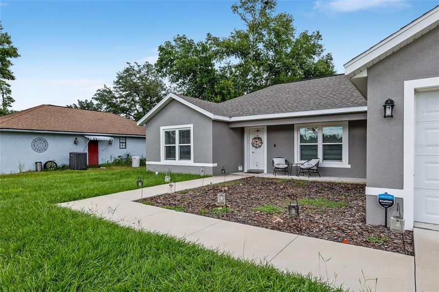 Front exterior of a new home in , Ocala, FL, highlighting curb appeal (Image 28). Front exterior of a new home in , Ocala, FL, highlighting curb appeal (Image 28).
