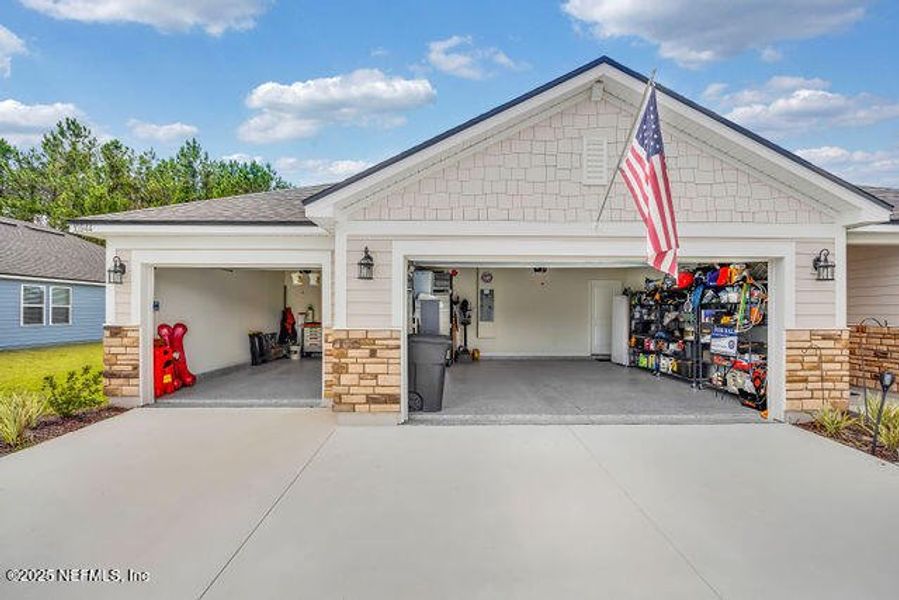 Front exterior of a new home in Edinburgh Village, Jacksonville, FL, highlighting curb appeal (Image 19). Front exterior of a new home in Edinburgh Village, Jacksonville, FL, highlighting curb appeal (Image 19).