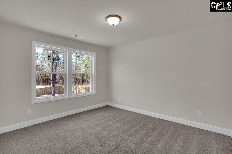 Spacious, unfurnished interior of a new home in Cottages at Roofs Pond, West Columbia (Image 31).