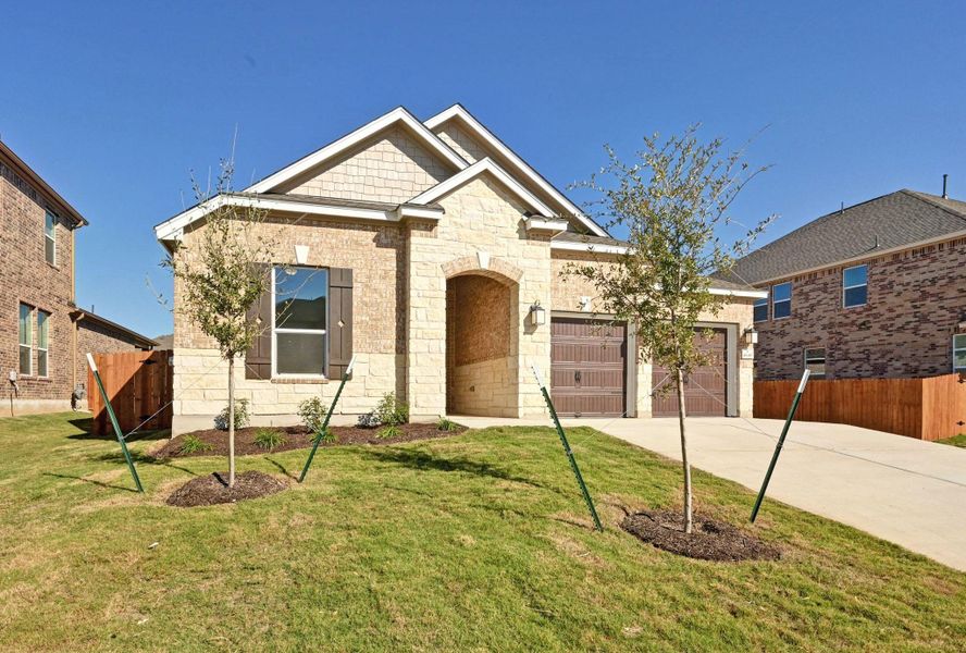 Front exterior of a new home in Salerno - Classic Collection, Round Rock, TX, highlighting curb appeal (Image 19).