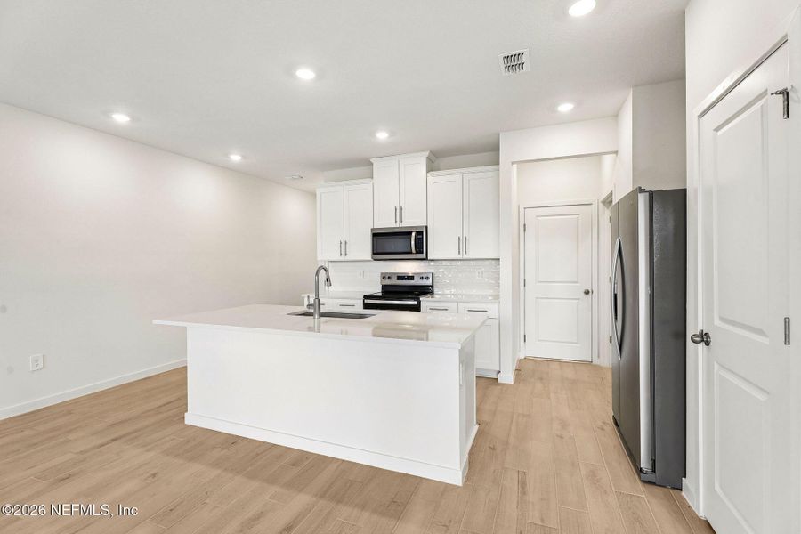 Furnished interior view inside a new home in The District at Oakleaf - The Grove, Middleburg (Image 5).