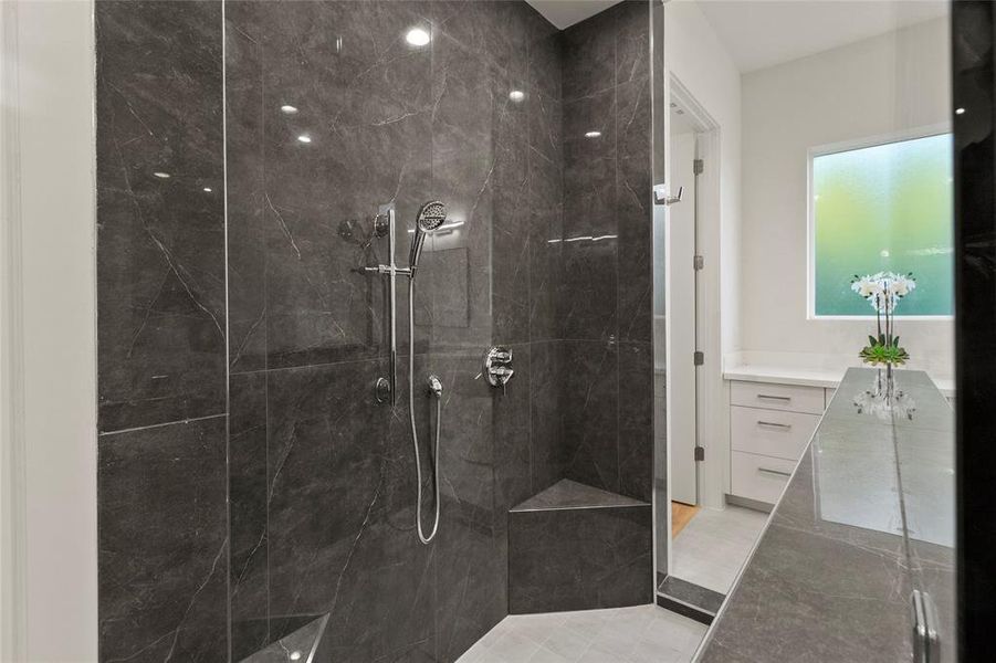 Luxury primary bedroom with double entry shower