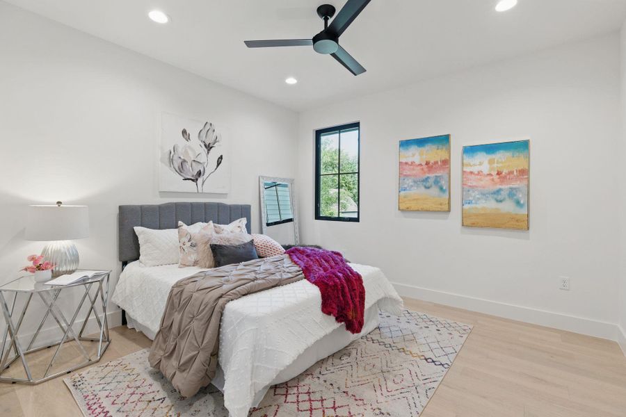 Bedroom featuring wood finished floors, recessed lighting, and ceiling fan