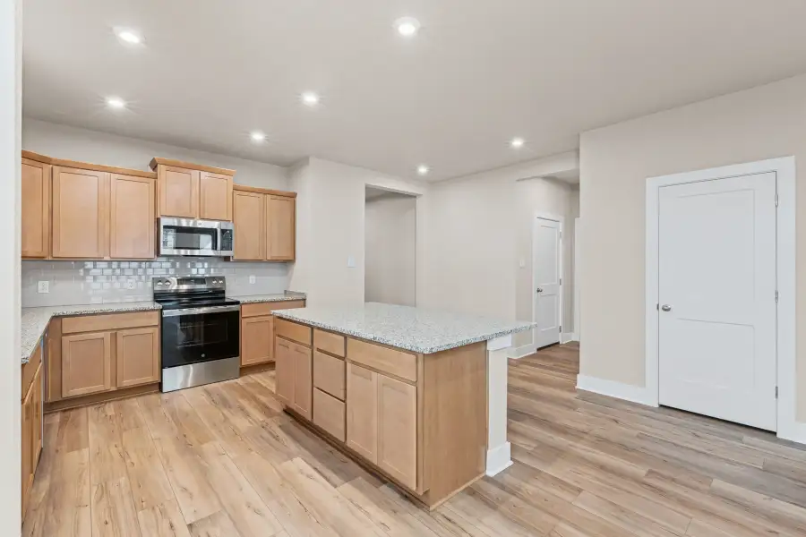 Representative furnished interior of a home built from the Amelia by Omega Builders in North Point, Temple (Image 7).