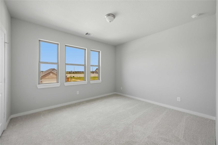 Spacious, unfurnished interior of a new home in Sunterra 40, Katy (Image 20).
