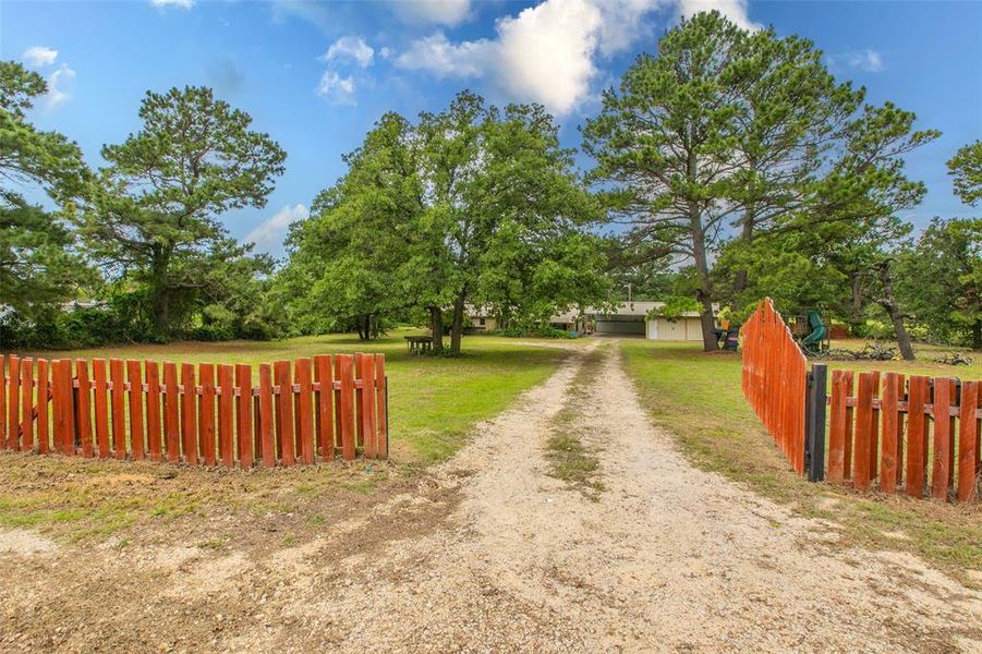 Private gated entrance and long driveway create a welcoming approach to the property. Private gated entrance and long driveway create a welcoming approach to the property.
