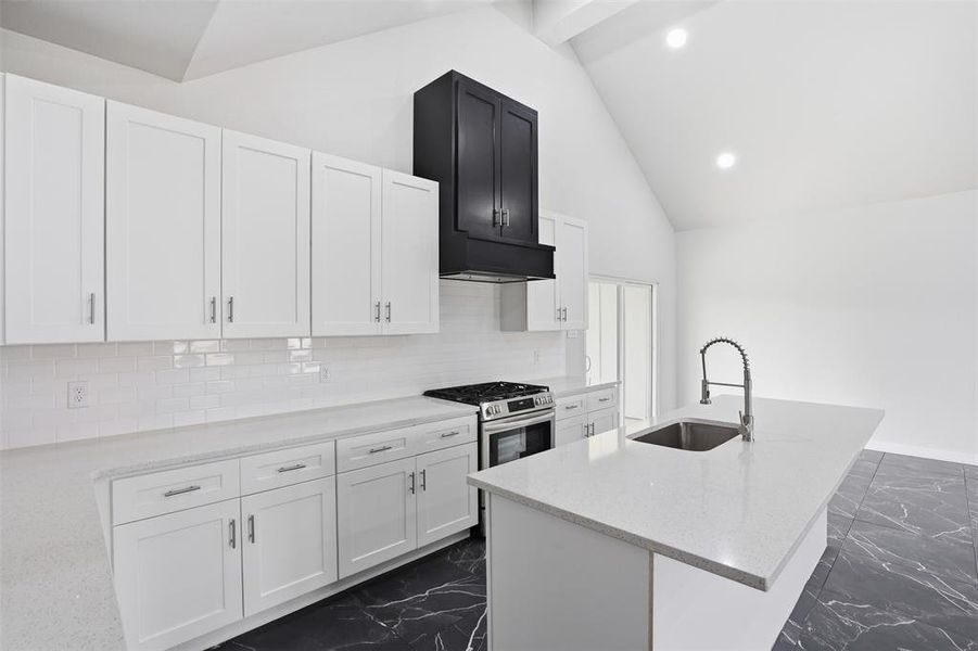 Kitchen featuring white shaker cabinetry, white subway tile backsplash, and light-toned countertops
