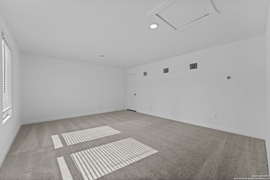 Spacious, unfurnished interior of a new home in Waterwheel: Coastline Collection, San Antonio (Image 14).