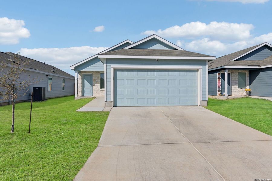 Front exterior of a new home in Somerset Meadows, San Antonio, TX, highlighting curb appeal (Image 27).