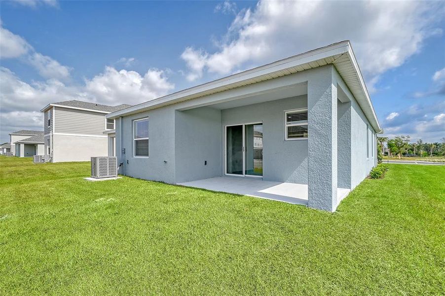 Exterior details and patio area of a home in Broadleaf, Parrish (Image 4).