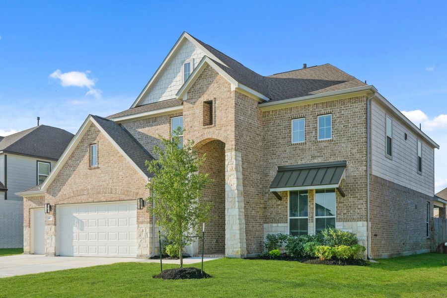 Front exterior of a new home in Beacon Hill, Waller, TX, highlighting curb appeal (Image 15). Front exterior of a new home in Beacon Hill, Waller, TX, highlighting curb appeal (Image 15).