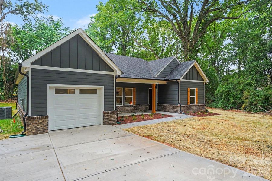 Front exterior of a new home in , Monroe, NC, highlighting curb appeal (Image 24).