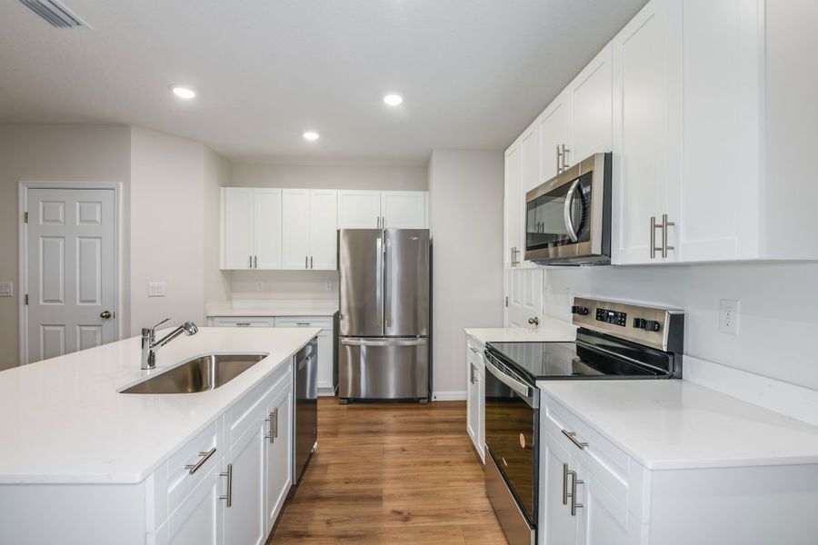 Furnished interior view inside a new home in Pasadena Woods, Dade City (Image 5).