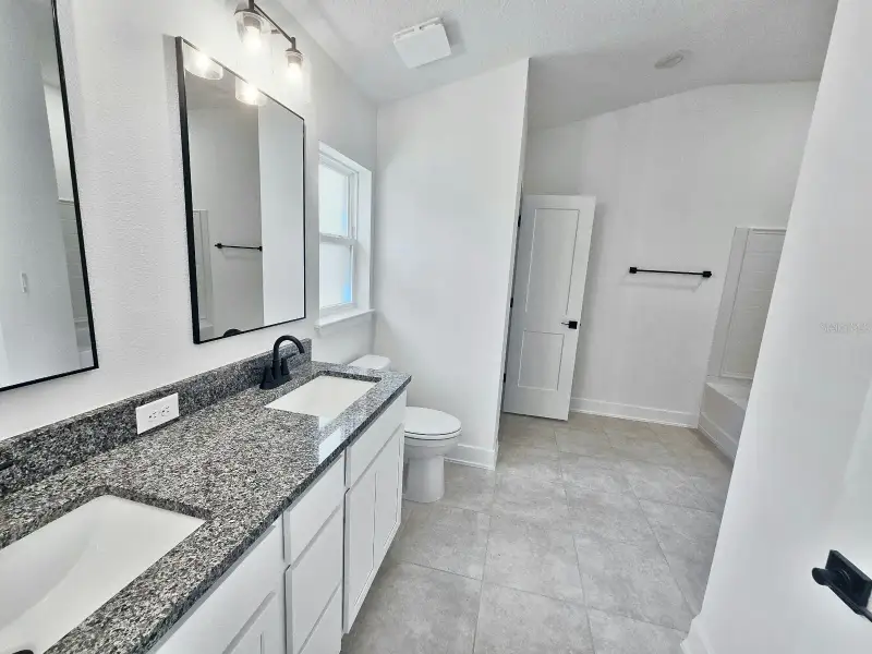 Furnished interior view inside a new home in Harmony Central, St. Cloud (Image 7).