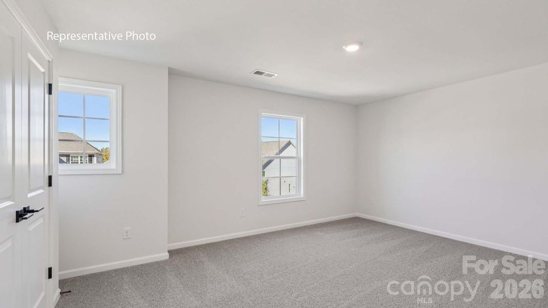 Spacious, unfurnished interior of a new home in Sanctuary at Southgate, Indian Trail (Image 32).