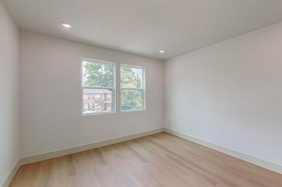 Spare room with light hardwood / wood-style floors