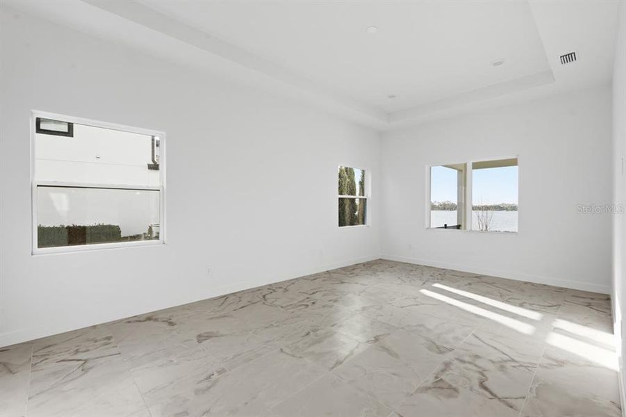 Spacious, unfurnished interior of a new home in Shorefront Cove, Winter Garden (Image 13).