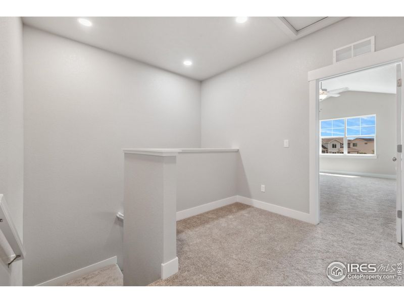 Upstairs loft area for small study or cozy reading nook!