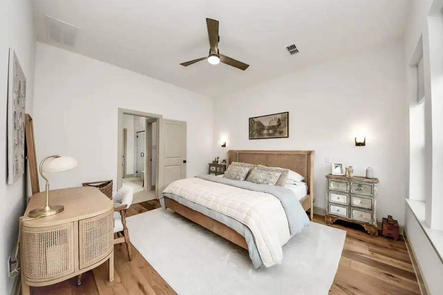 Experience ultimate relaxation in this spacious first-floor primary bedroom, offering a serene private retreat feel.