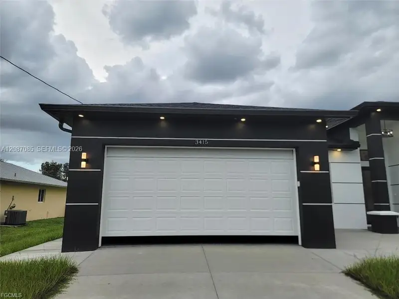 Front exterior of a new home in , Lehigh Acres, FL, highlighting curb appeal (Image 2). Front exterior of a new home in , Lehigh Acres, FL, highlighting curb appeal (Image 2).