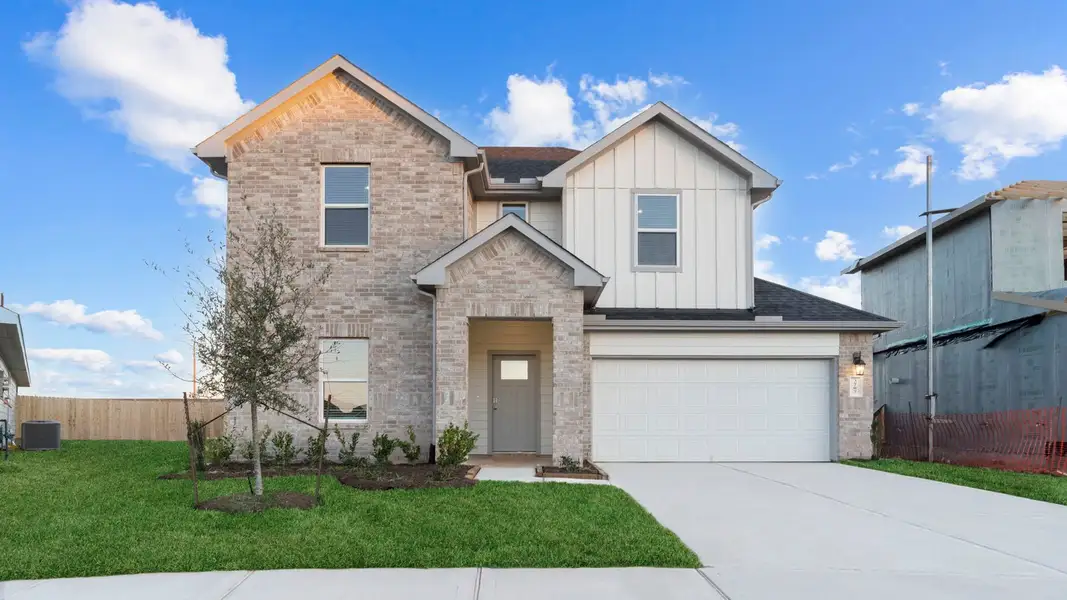 Front exterior of a new home in Evergreen, Rosenberg, TX, highlighting curb appeal (Image 1). Front exterior of a new home in Evergreen, Rosenberg, TX, highlighting curb appeal (Image 1).