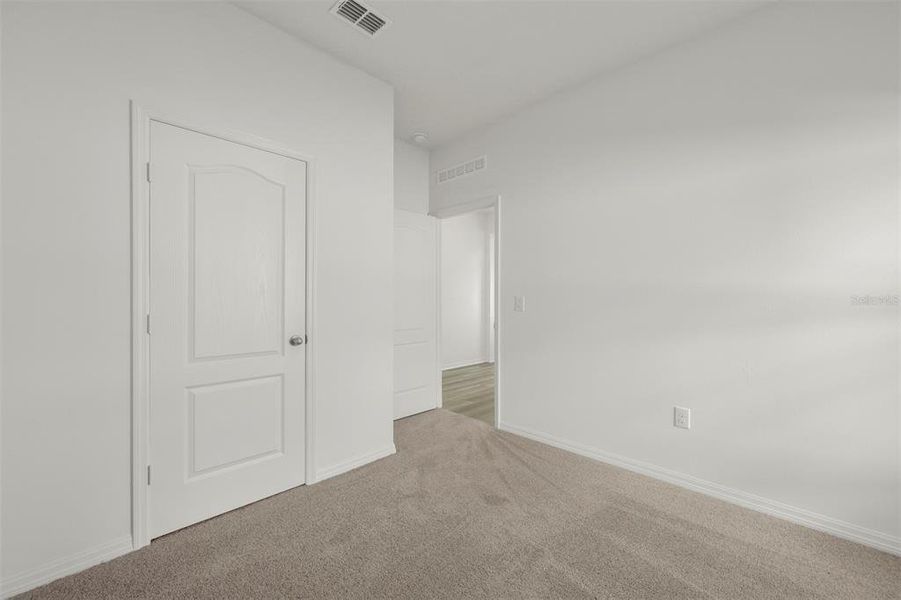 Spacious, unfurnished interior of a new home in Peach Crossings, Winter Haven (Image 29).