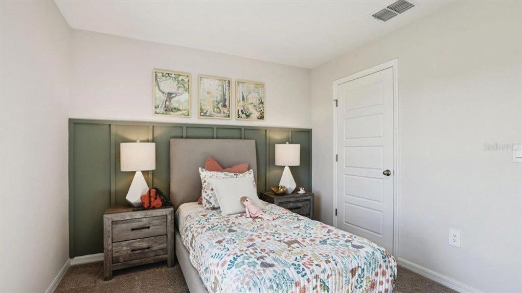 Furnished interior view inside a new home in Lake Deer Estates, Poinciana (Image 29).