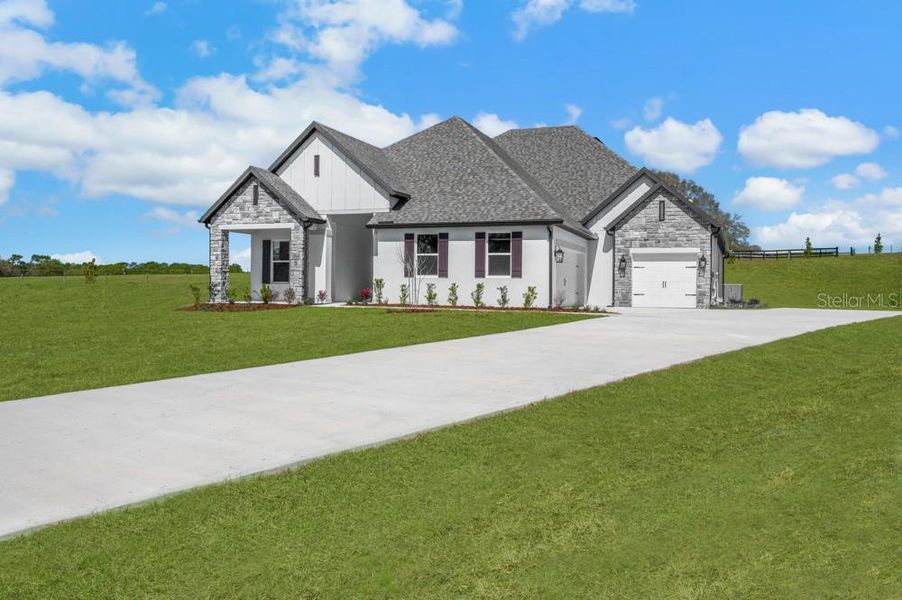 Front exterior of a new home in , Fruitland Park, FL, highlighting curb appeal (Image 24). Front exterior of a new home in , Fruitland Park, FL, highlighting curb appeal (Image 24).