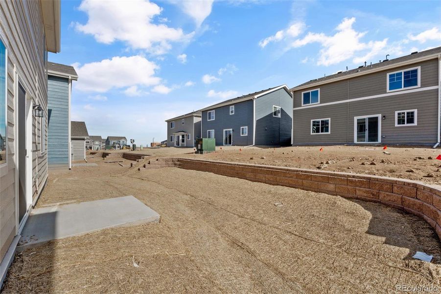 Exterior details and patio area of a home in Sky Ranch – Uptown Collection, Watkins (Image 20).