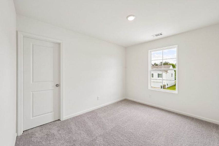 A room with a door and a window. A room with a door and a window.