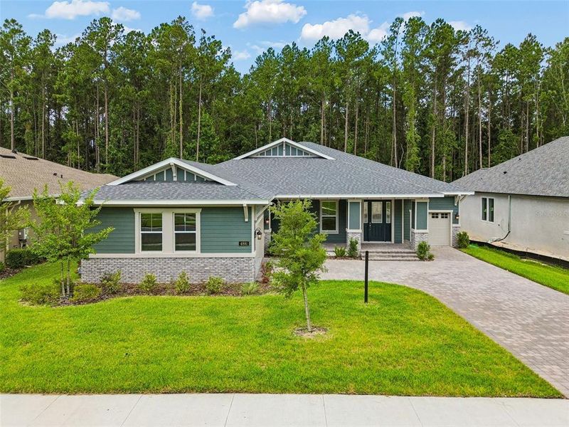 Front exterior of a new home in Southern Hills Plantation, Brooksville, FL, highlighting curb appeal (Image 26). Front exterior of a new home in Southern Hills Plantation, Brooksville, FL, highlighting curb appeal (Image 26).
