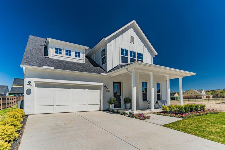 View of front facade featuring a garage