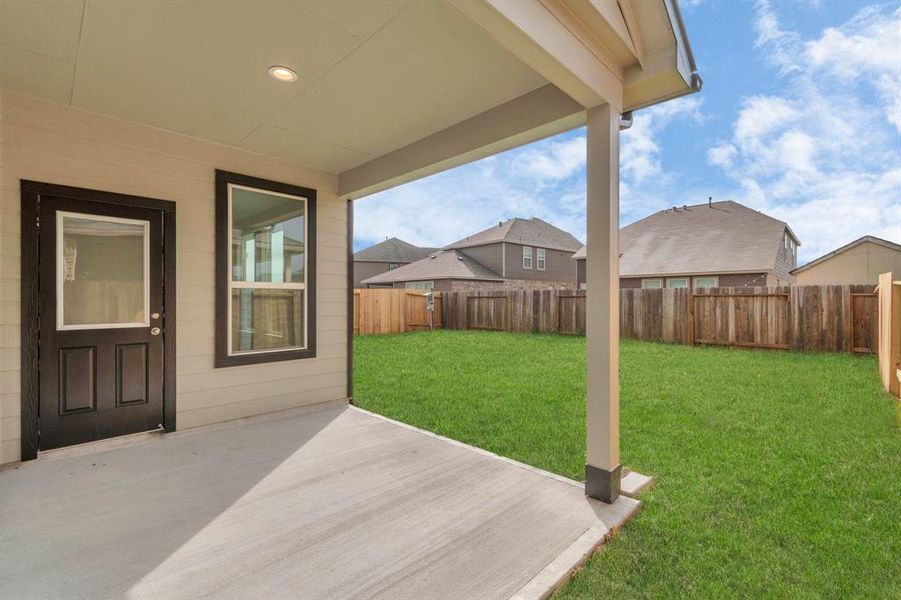 Come and see this spacious backyard with its beautiful covered patio. Sample photo of completed home with similar floor plan. As-built interior colors and selections may vary.