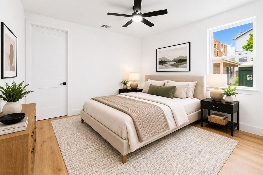 Secondary bedroom located in 1st level. Photo is virtually staged.