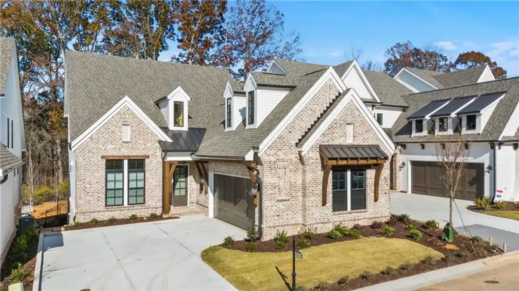 Front exterior of a new home in Waterside Single Family, Peachtree Corners, GA, highlighting curb appeal (Image 1). Front exterior of a new home in Waterside Single Family, Peachtree Corners, GA, highlighting curb appeal (Image 1).