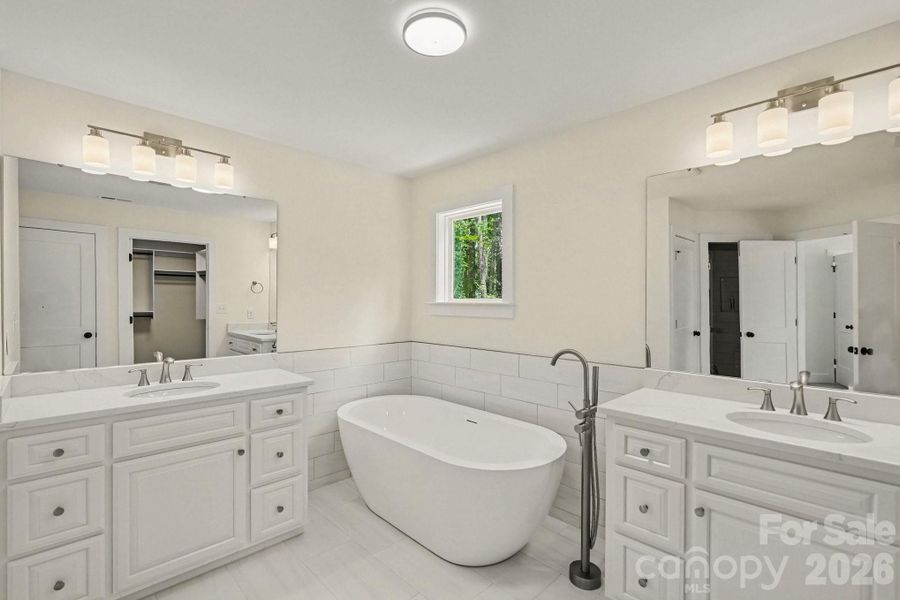 Gorgeous primary bath with two vanities, vessel tub and separate walk in shower Gorgeous primary bath with two vanities, vessel tub and separate walk in shower